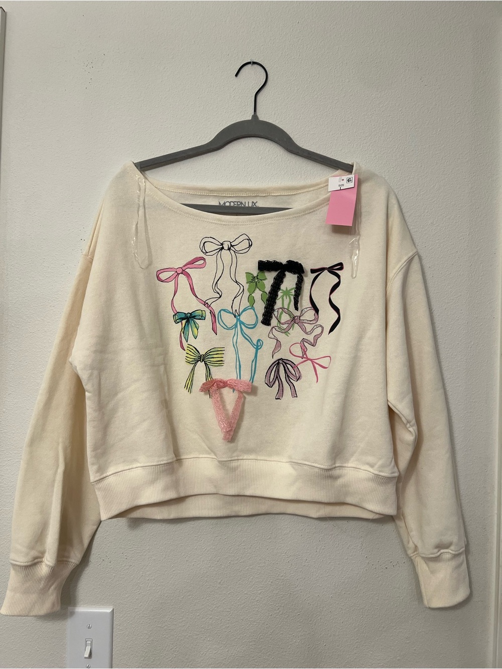 Modern Lux Cream Top with Black Bow Outline